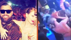 Taylor Swift and Travis Kelce Ring in the New Year With Midnight Kiss